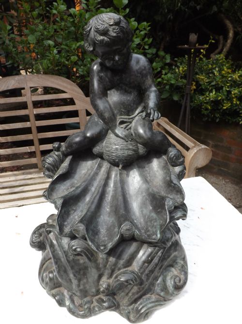 late c19th bronze fountain modelled as cherub riding astride shell upon foaming waves
