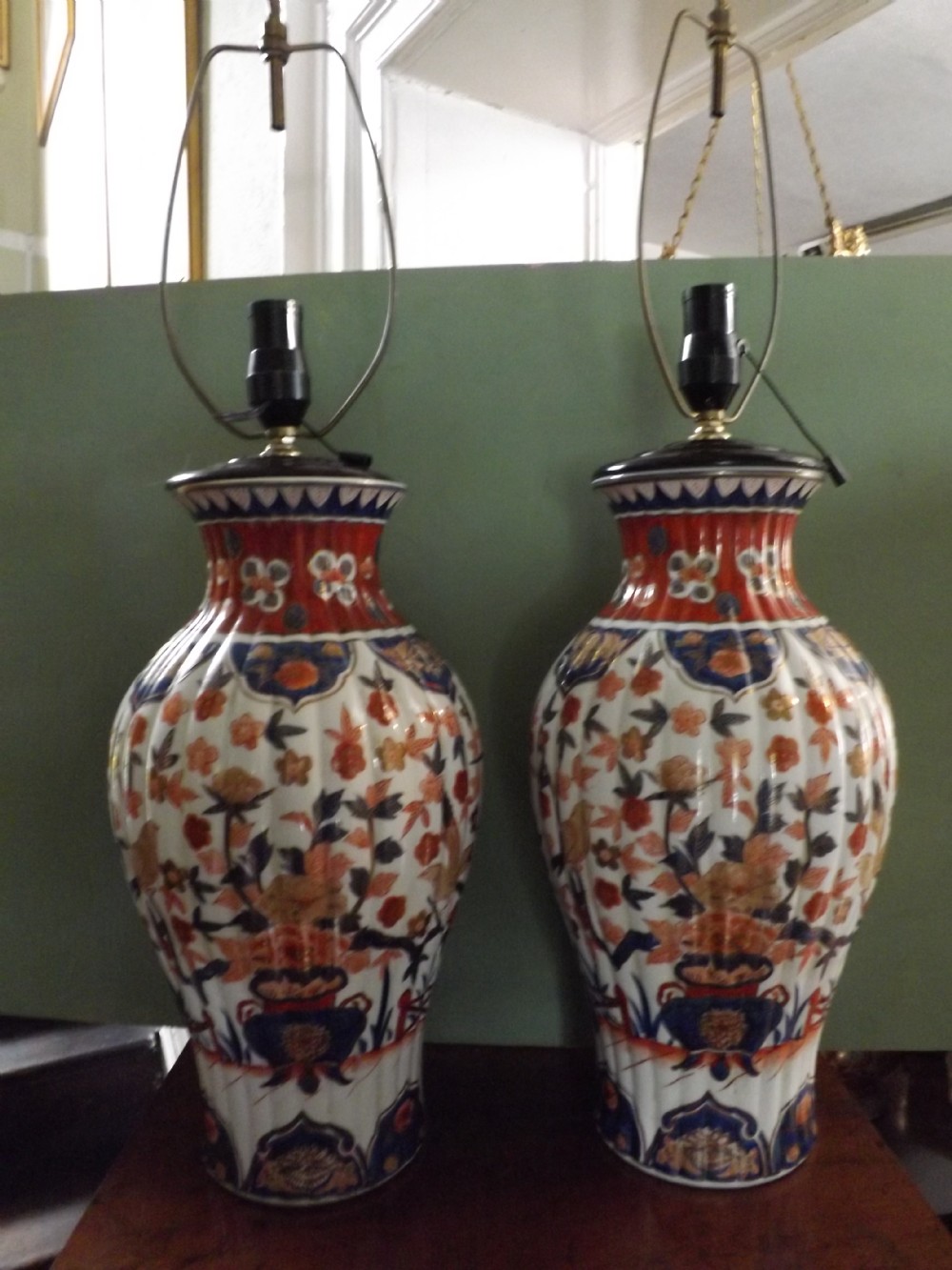 pair late c19th japanese imari porcelain vases now fitted with lamp conversions