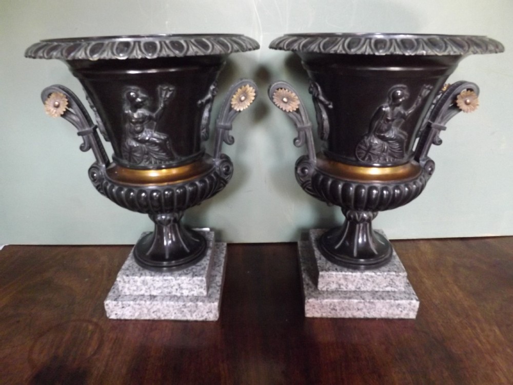 pair c19th patinated bronze and gilt bronze campanashaped urns