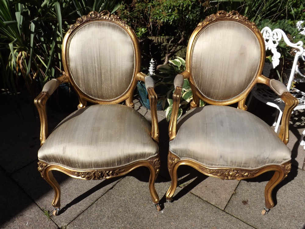 pair of early c20th french giltwood boudoirsalon armchairs