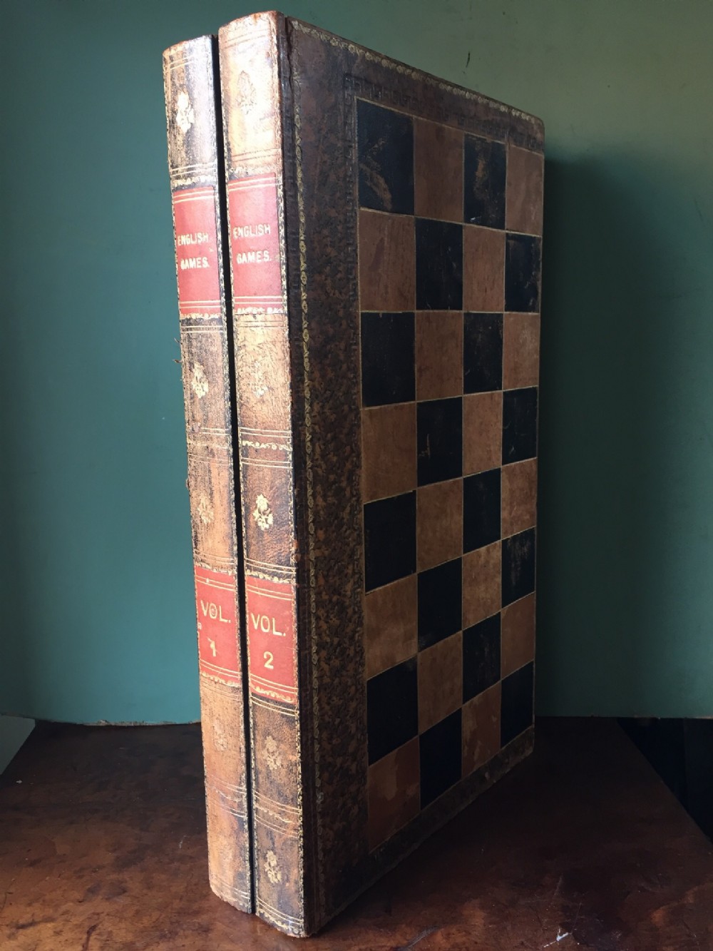 early c20th leatherbound folding games board modelled as 2 volumes of books