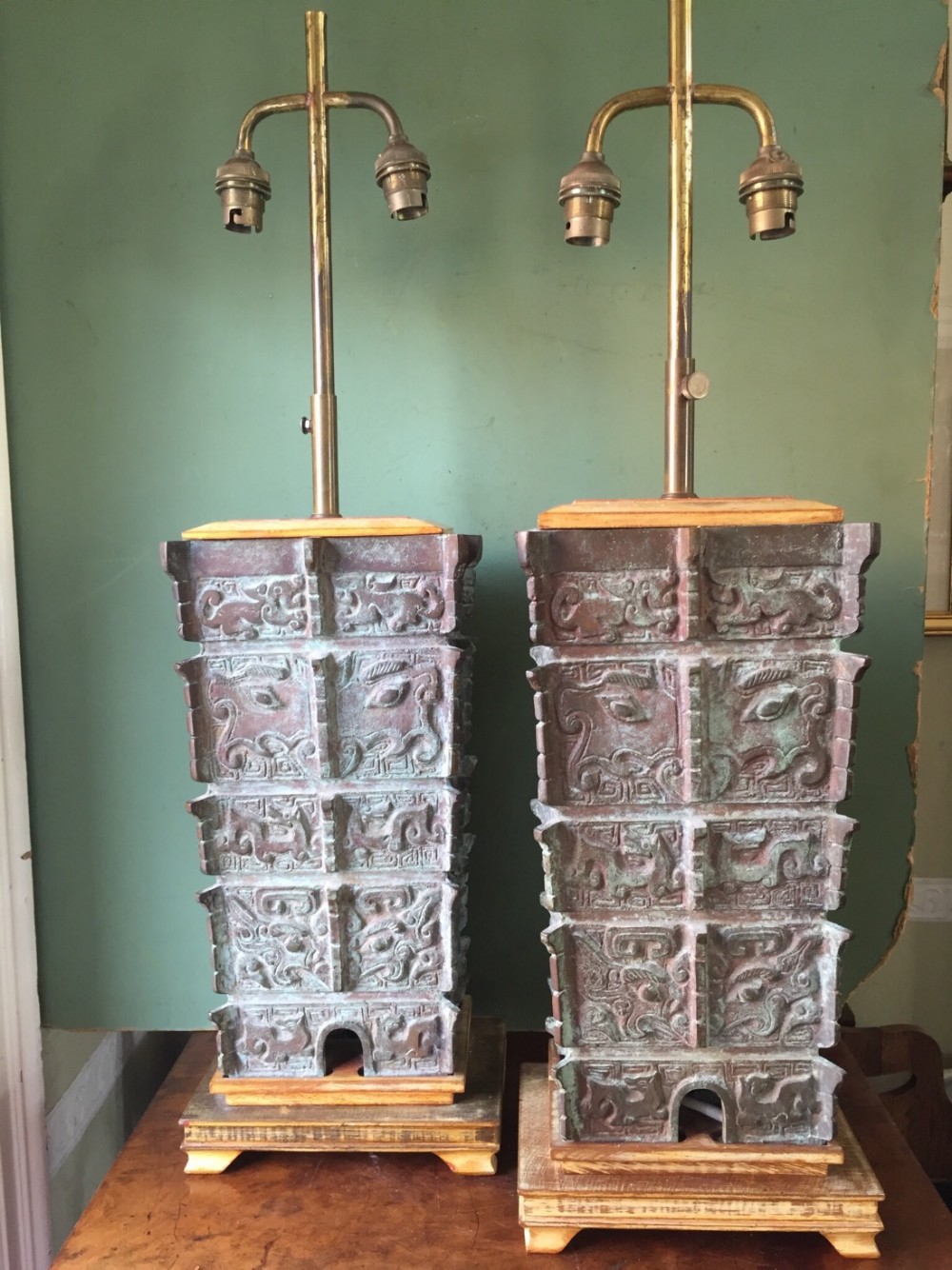 pair of early c20th chinese verdigris bronze lampbases of archaic shang dynasty 'fanglei' design