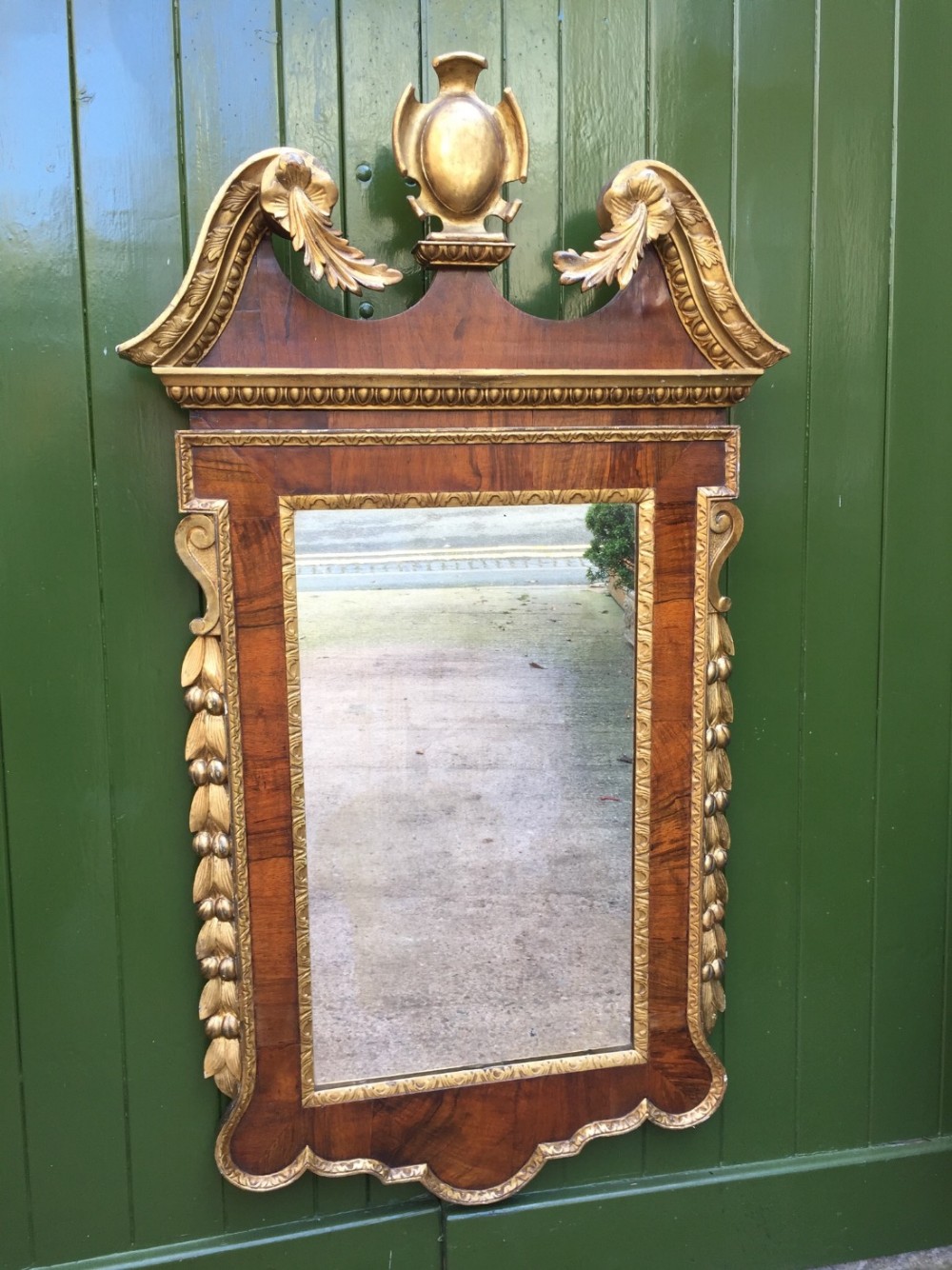 c18th george ii period walnut and carved 'parcel' gilt framed mirror of palladian design