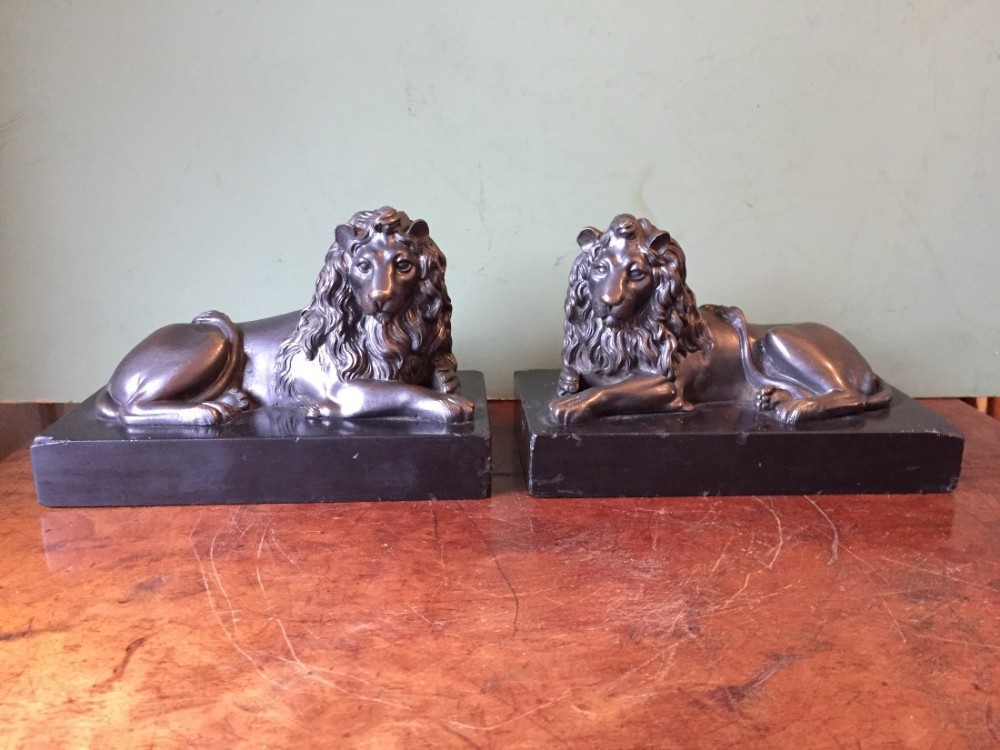 pair of midc19th french bronze lions on original black marble plinth bases