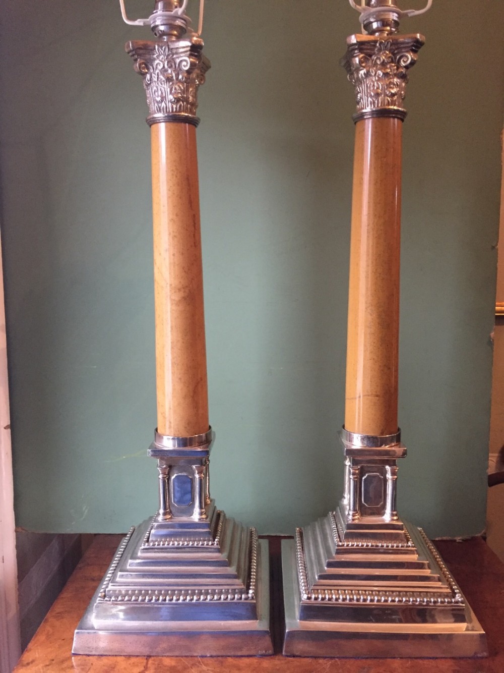 pair of early c20th silverplated and marble column corinthiancapped classicalstyle table lamps