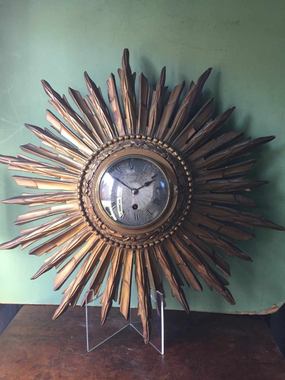 early c20th french giltwood sunburst clock with silvered dial