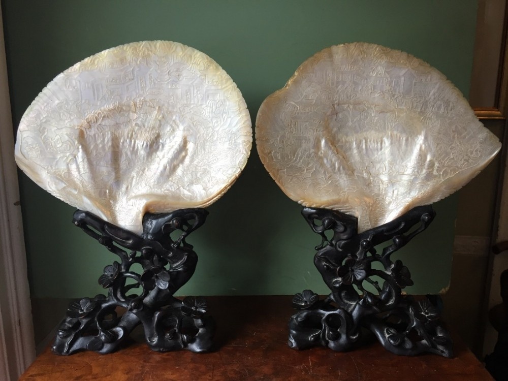 superb pair of late c19th chinese cantonese intricately carved nacre shells mounted on their original bespoke period carved hardwood stands
