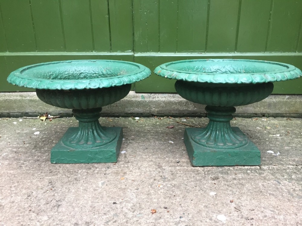 pair of small mid c19th castiron terrace wall or garden vases