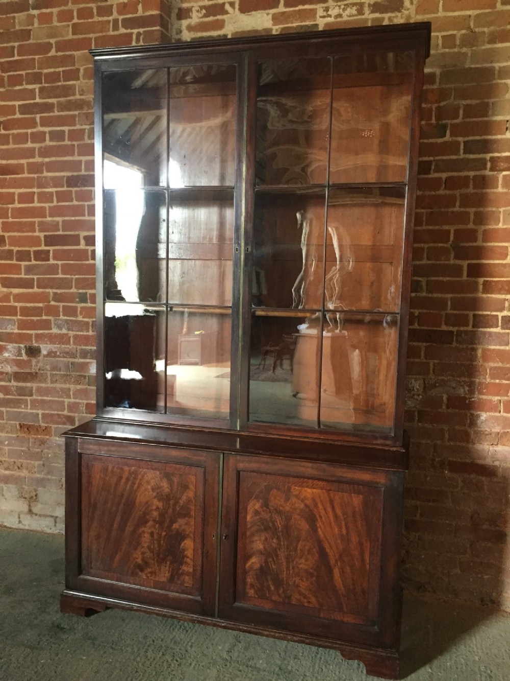 fine c18th early george iii period mahogany library bookcase with a fitted cupboard base in outstanding totally original and untouched condition