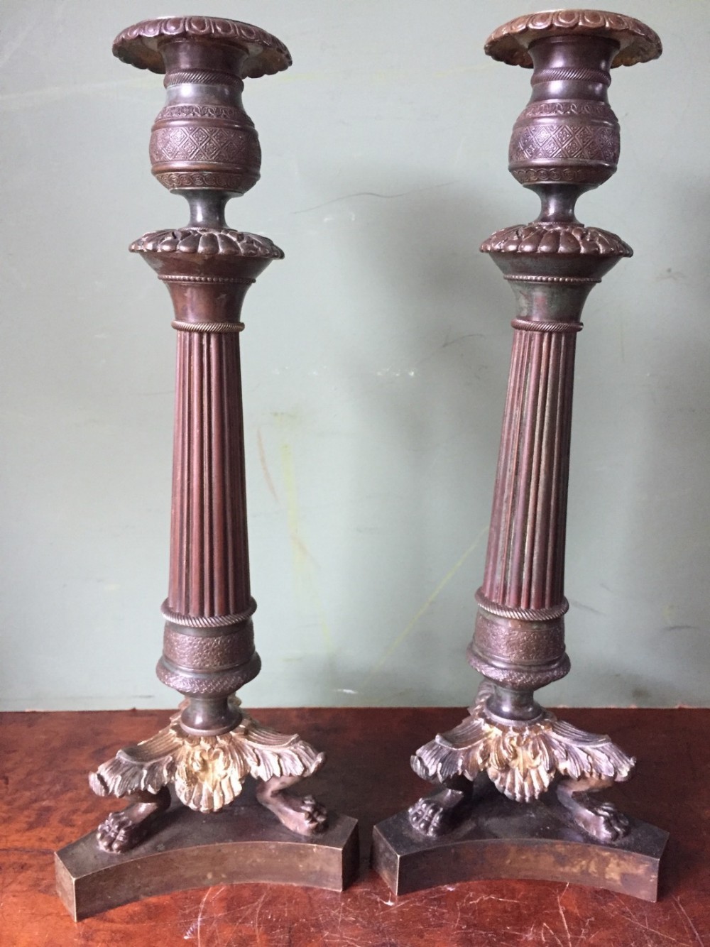 pair of early c19th french charles x period bronze empire design candlesticks