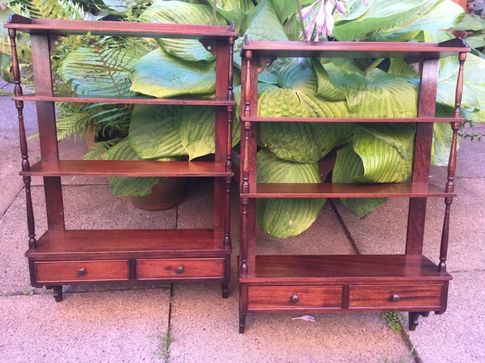 pair of early c20th chippendale revival style mahogany wallhanging display shelves