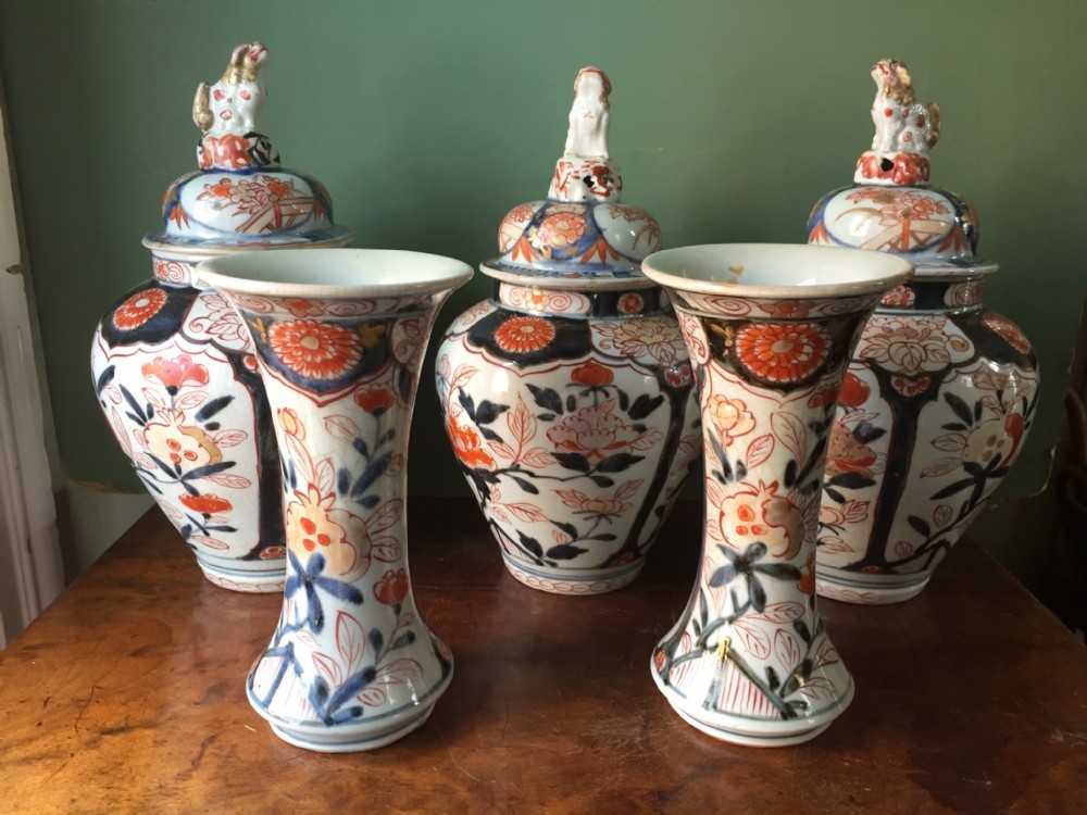 early c18th japanese imari pattern composite garniture of 5 vases