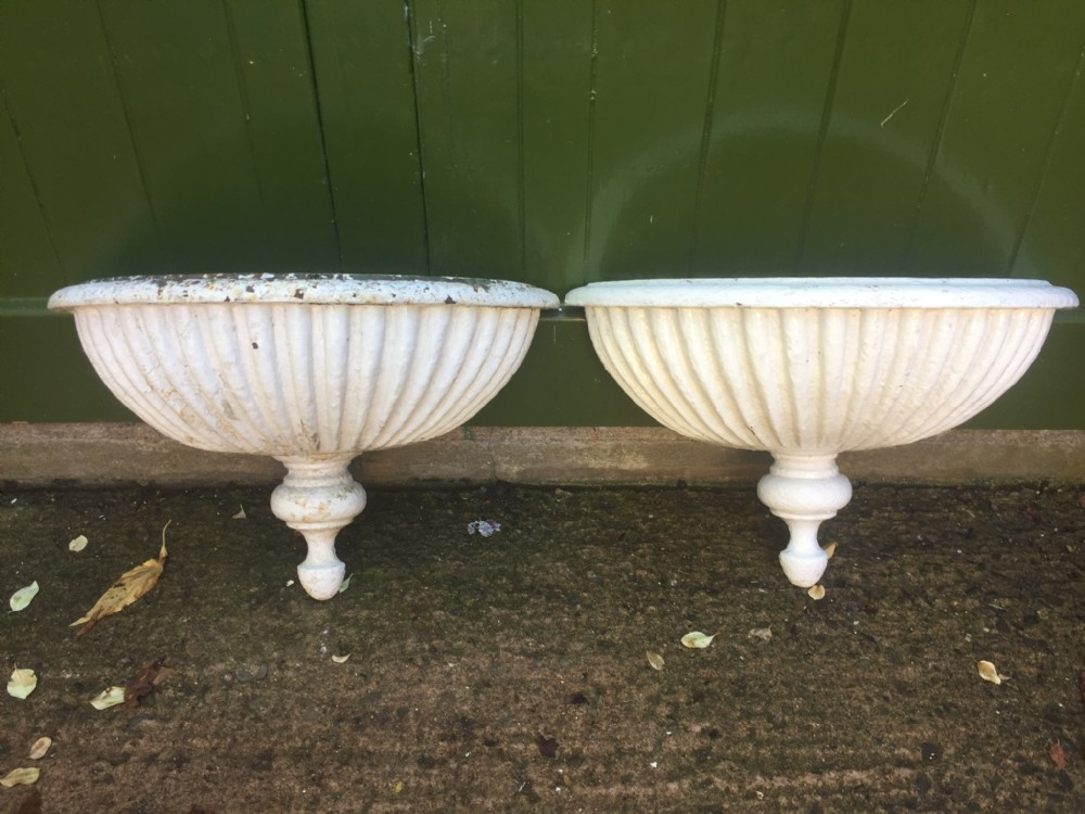 pair of early c19th castiron semicircular wallhanging planters of rare form