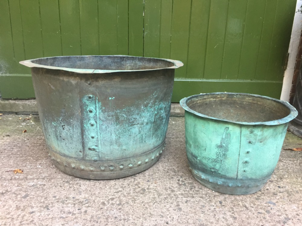 2 late c19th copper 'coppers' of riveted construction with verdigris patination