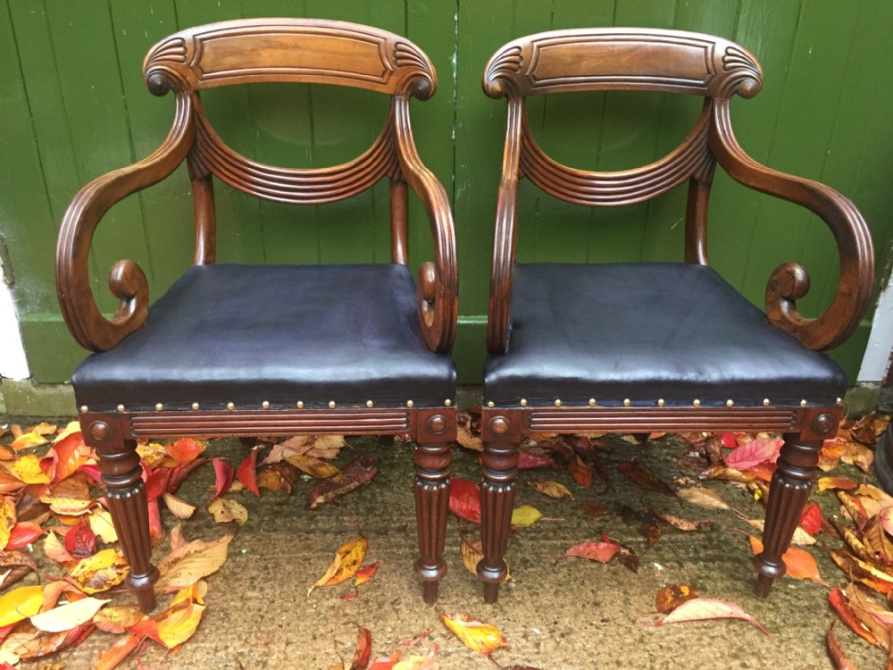 pair of early c19th regency period carved mahogany armchairs with stylish 'swag ' or lambrequin back splats