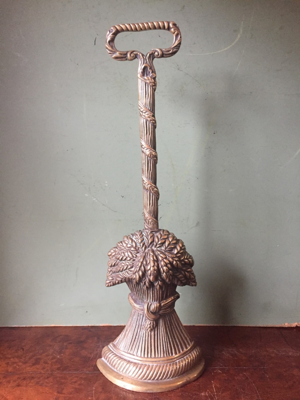 early c19th regency period cast brass doorporter or doorstop the base modelled as a sheaf of wheat
