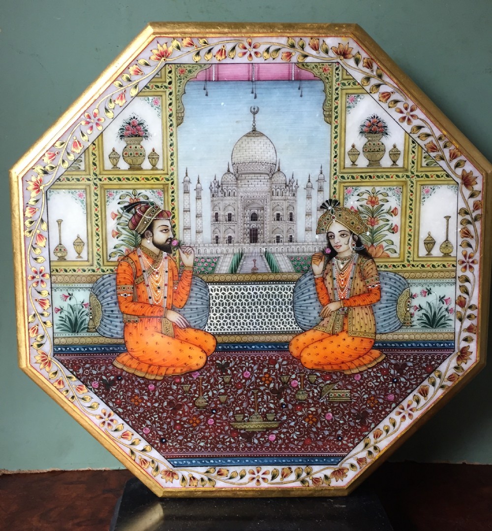 finely painted early c20th indian octagonal marble panel depicting shah jahan and mumtaz mahal posed on a carpet before the taj mahal in agra