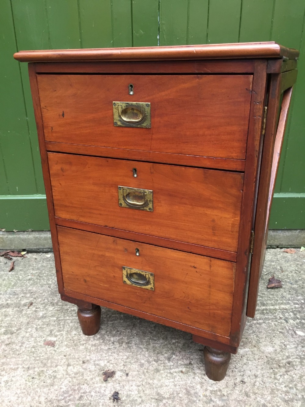 c19th mahogany military or naval campaign pedestal chest of drawers with a foldover flap top