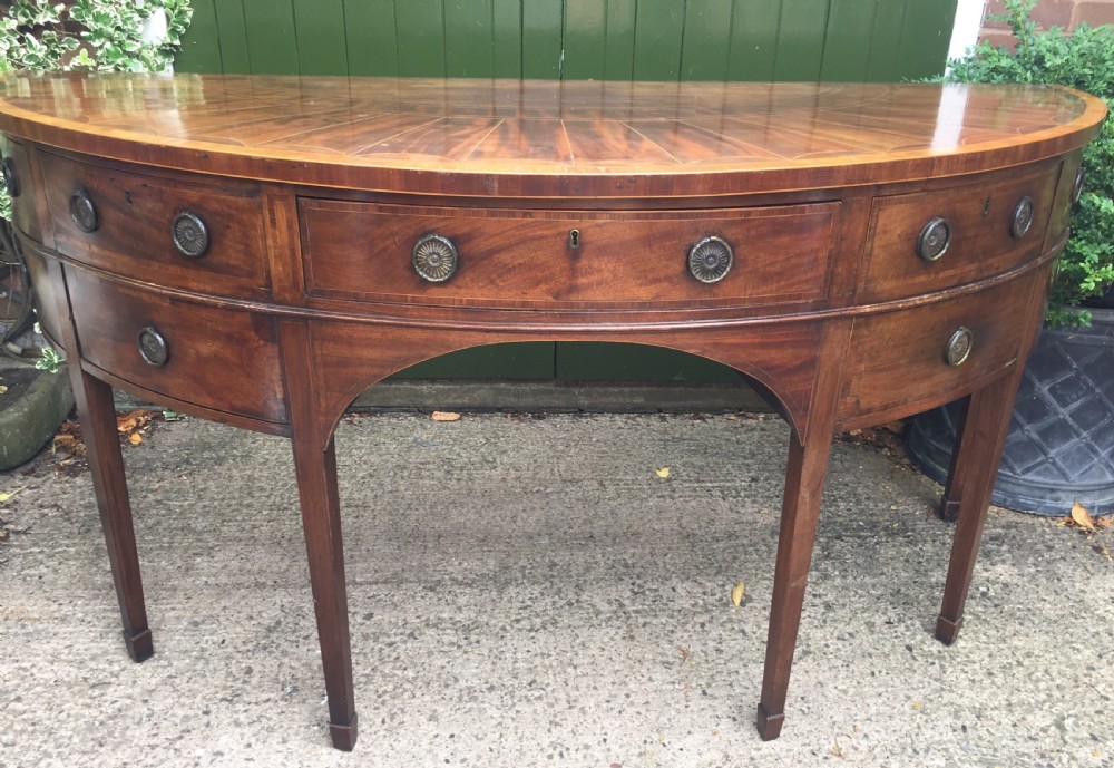 fine late c18th george iii period mahogany sideboard of demilune rounded form