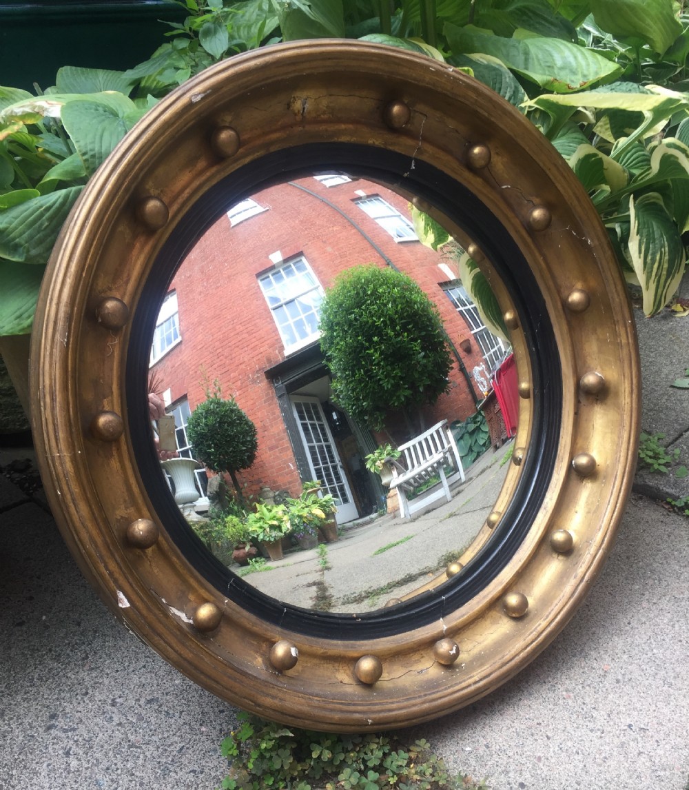 early c19th regency period giltframed circular convex mirror in as found unrestored 'countryhouse' condition