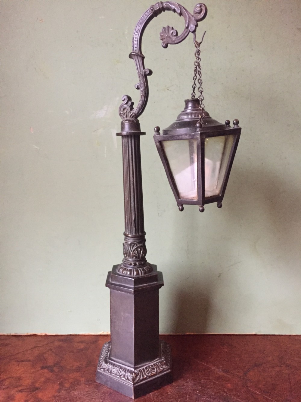 interesting c19th william iv period bronze desktop candlelamp modelled as a miniature hanging lantern or lamp