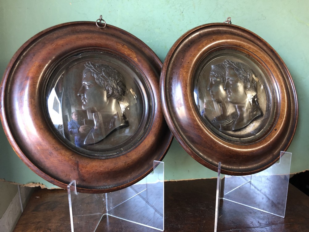pair of early c19th french empire cast lead bronzed roundels of napoleon and marielouise bonaparte in turned mahogany frames