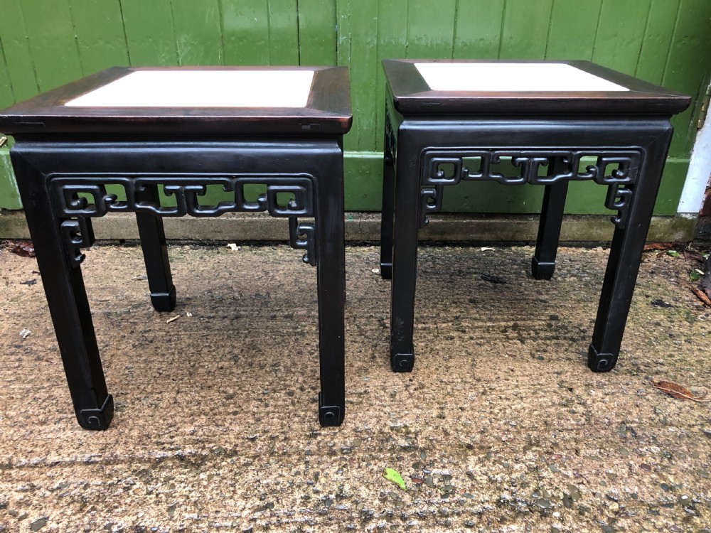 pair of late c19th early c20th chinese carved hardwood square tables with inset marble tops