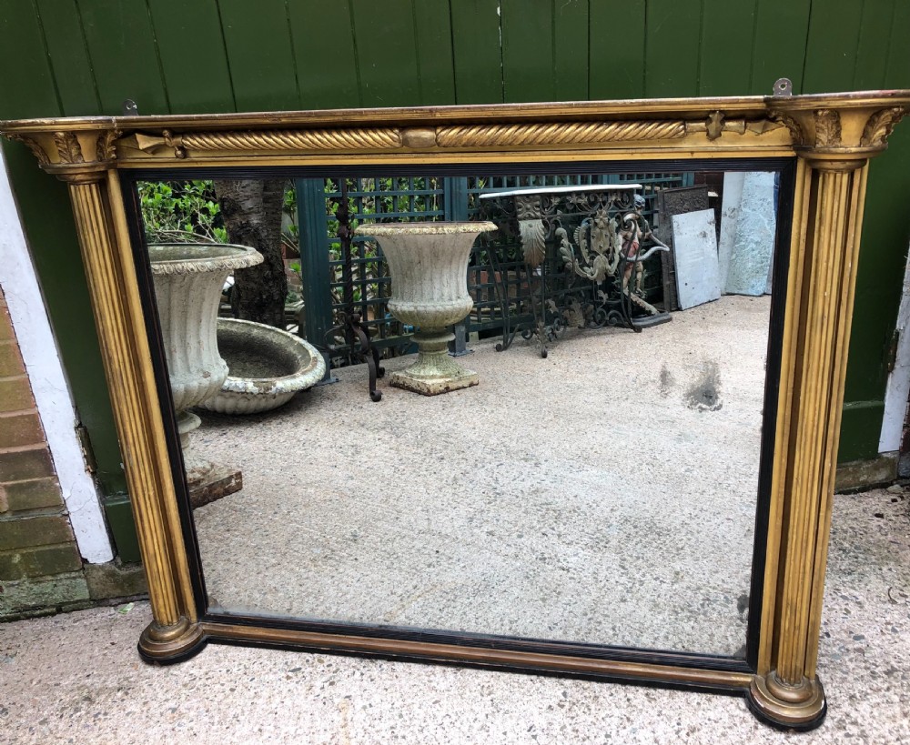 early c19th regency period carved giltwood overmantel mirror of practical scale and proportions
