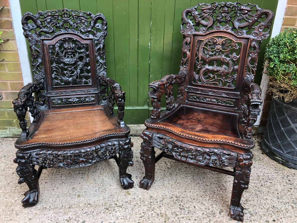 magnificent matched pair of late c19th chinese qing dynasty carved hardwood hongmu thronestyle armchairs