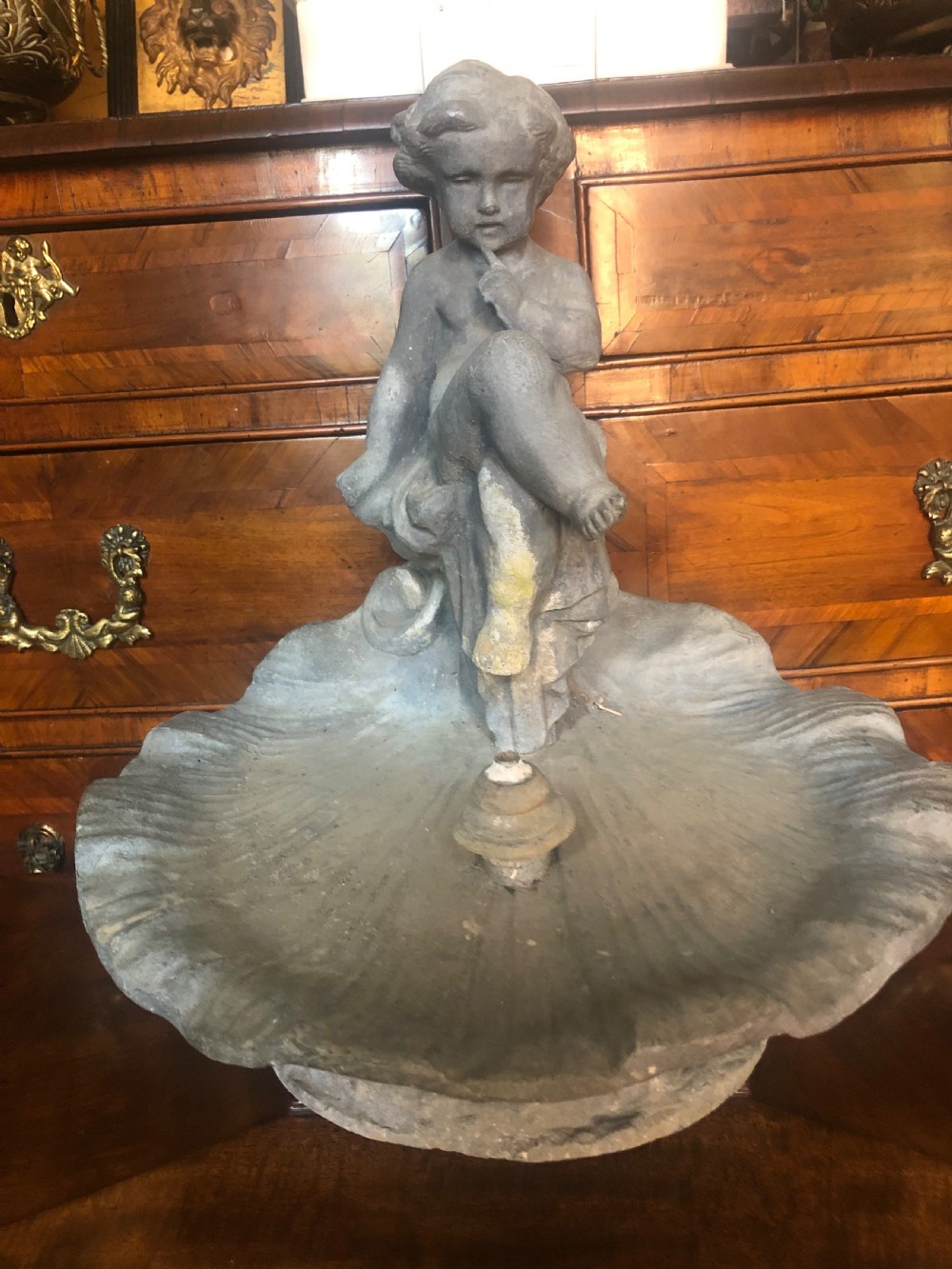 charming early c20th lead fountain or water feature modelled as a cherub seated on a shell