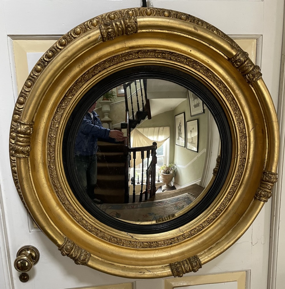 large early c19th regency period carved giltwood frame convex plate mirror