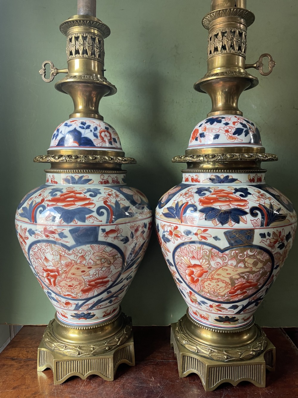 pair of mid 19th japanese imari pattern porcelain vases lamps and covers mounted as oil lamps