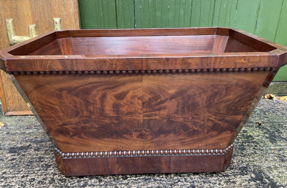 large early c19th george iv period mahogany open wine cooler or cistern of classical sarcophagus form