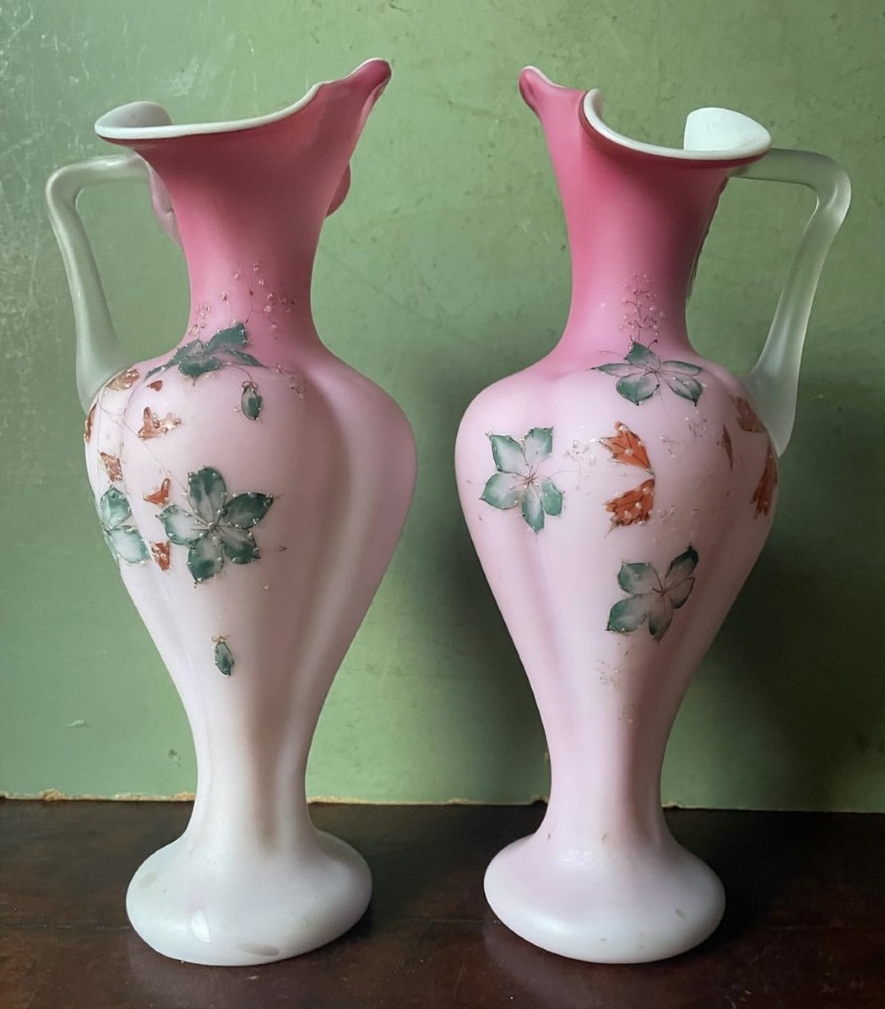 pair of late c19th victorian period satin opaline cased glass ewers with applied enamel decoration