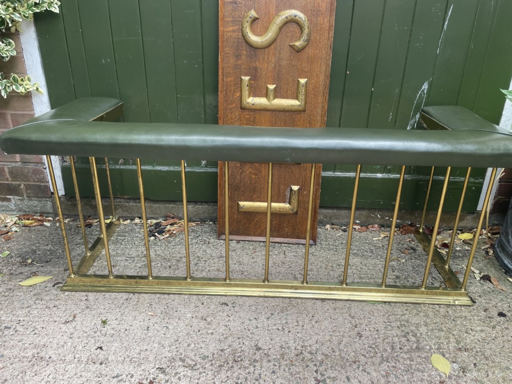 early c20th edwardian period polished brass and leather seated club fender of restrained design