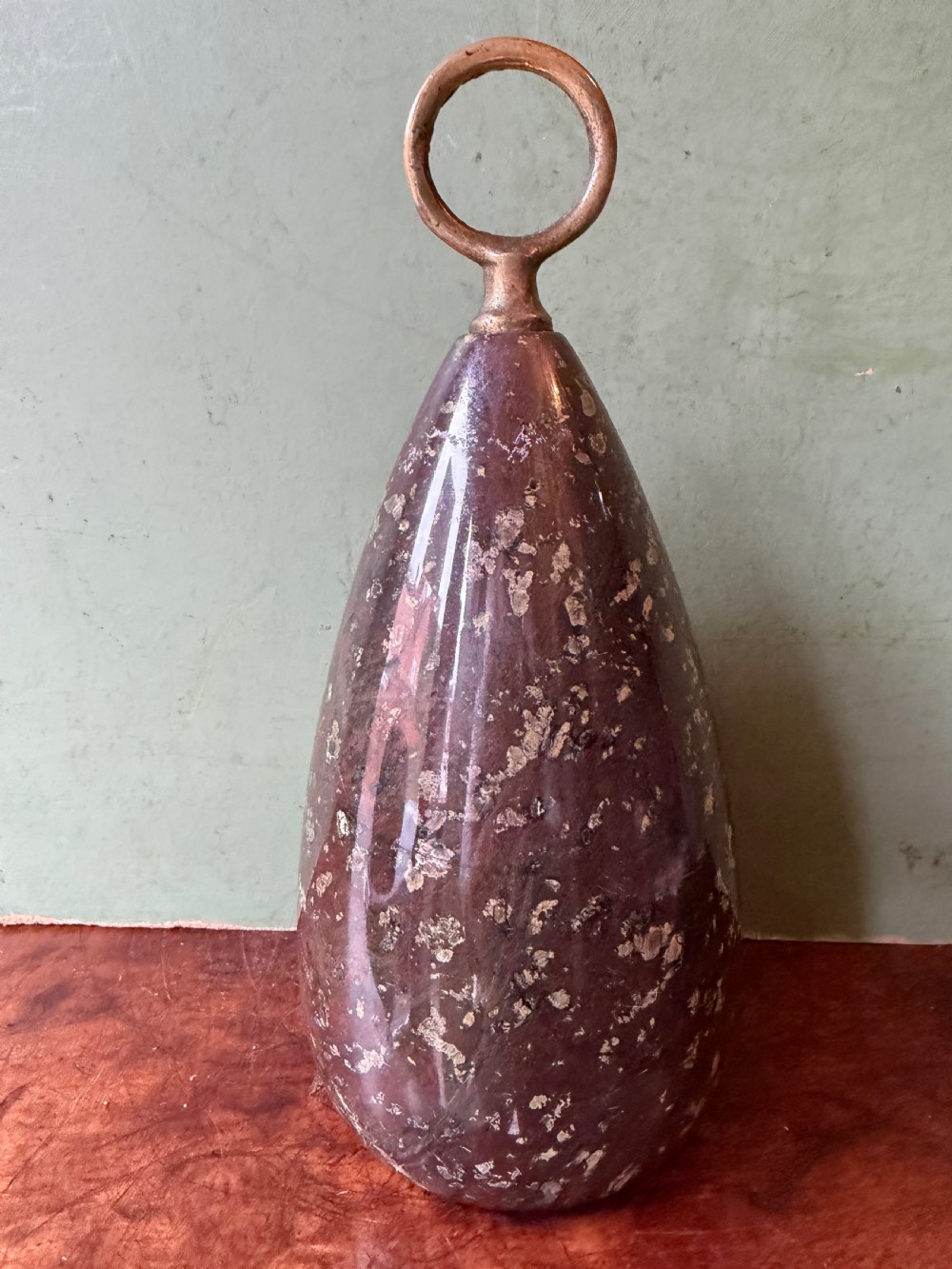 c19th cornish serpentine marble ovoid doorporter or stop with brass loop ring handle