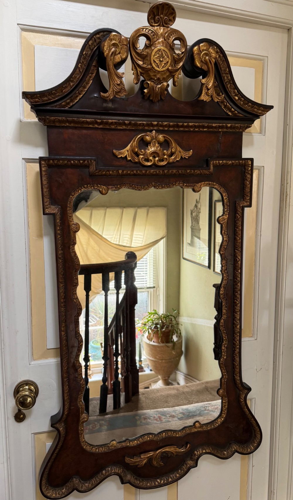 impressive george ii period style walnut and parcel gilt framed mirror of larger scale and proportions in the manner of william kent