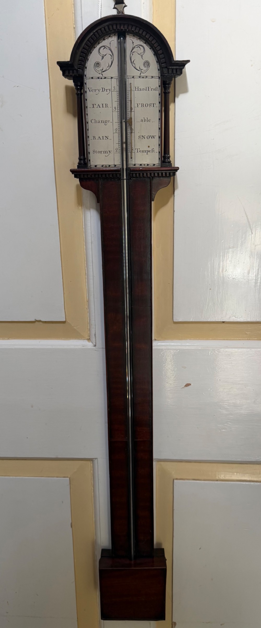 elegant c18th george iii period mahogany stick barometer with a silvered scale and architecturally inspired top
