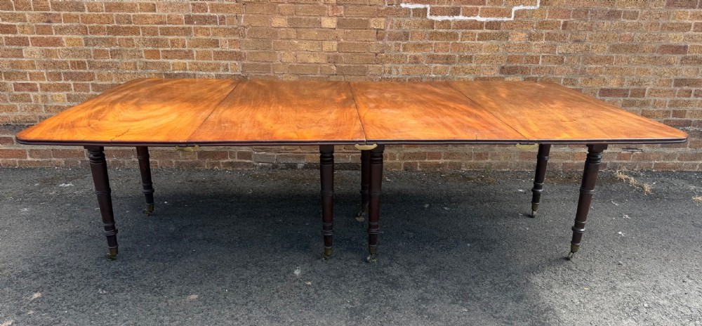 early c19th regency period mahogany dining table of highly versatile and restrained design