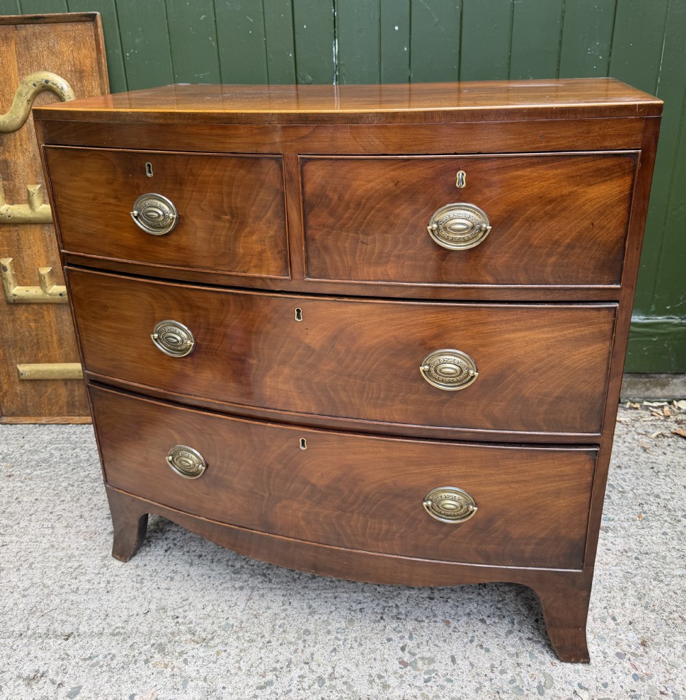 early c19th late george iii period figured mahogany bowfront chest of 2 short and 2 long drawers of compact scale and proportions